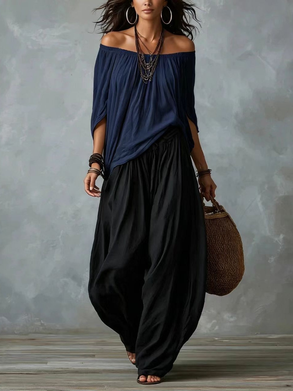Blusa blanca con hombros descubiertos y pantalones de corte ancho estilo linterna
