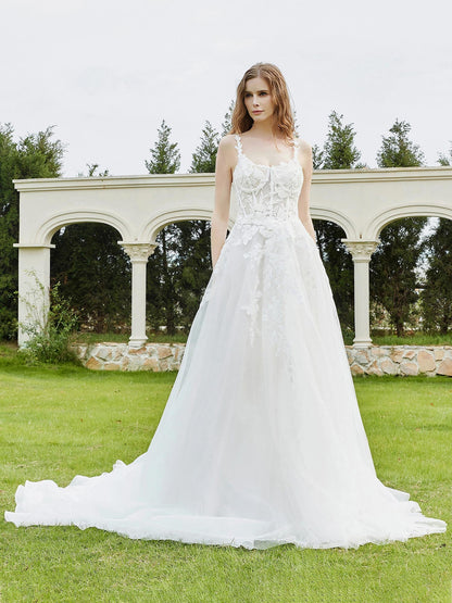 Vestido de Novia de Tul Marfil con Tirantes Espagueti y Cola de Capilla