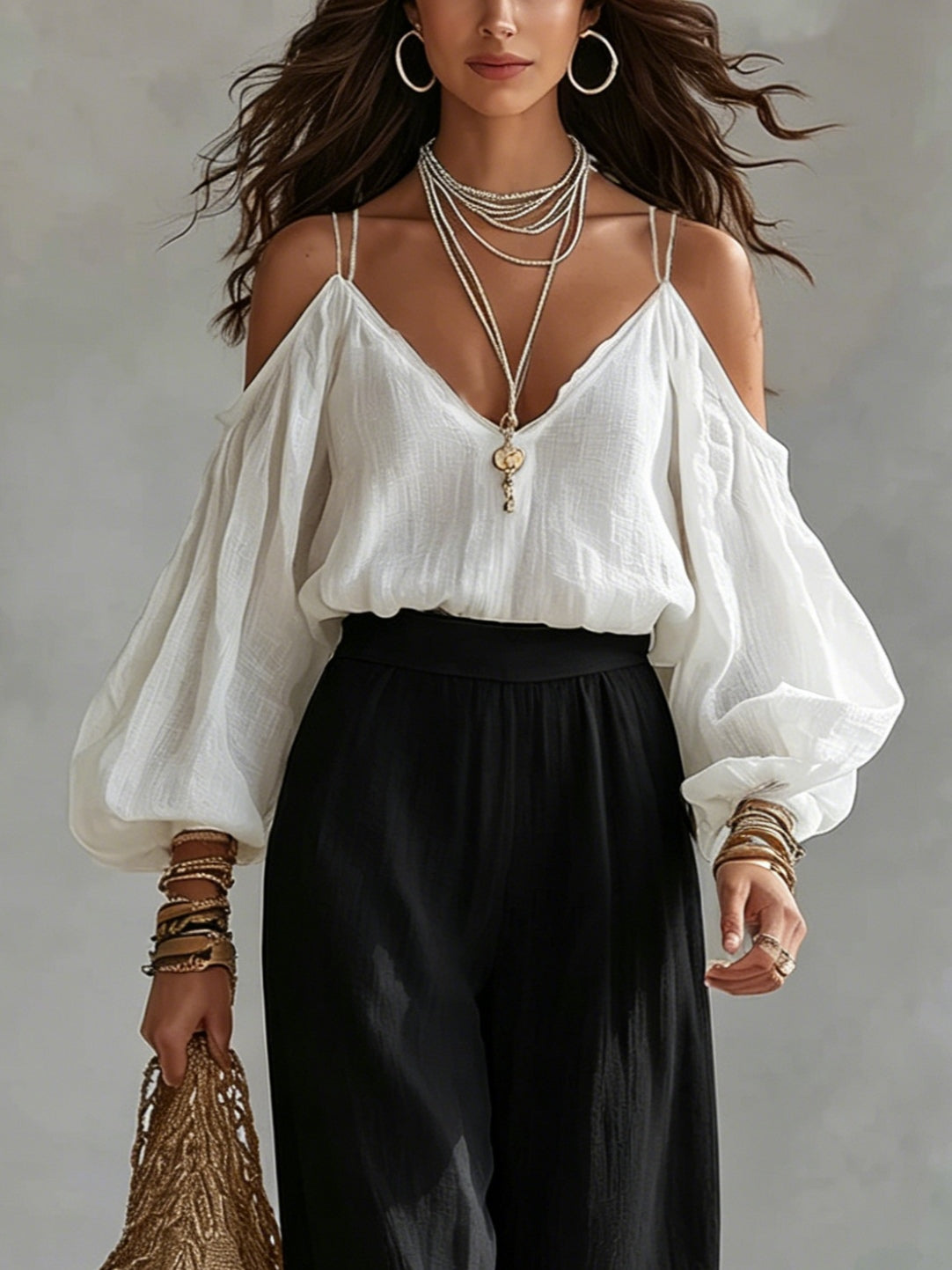 Conjunto de blusa blanca sin mangas y pantalones negros de pierna ancha