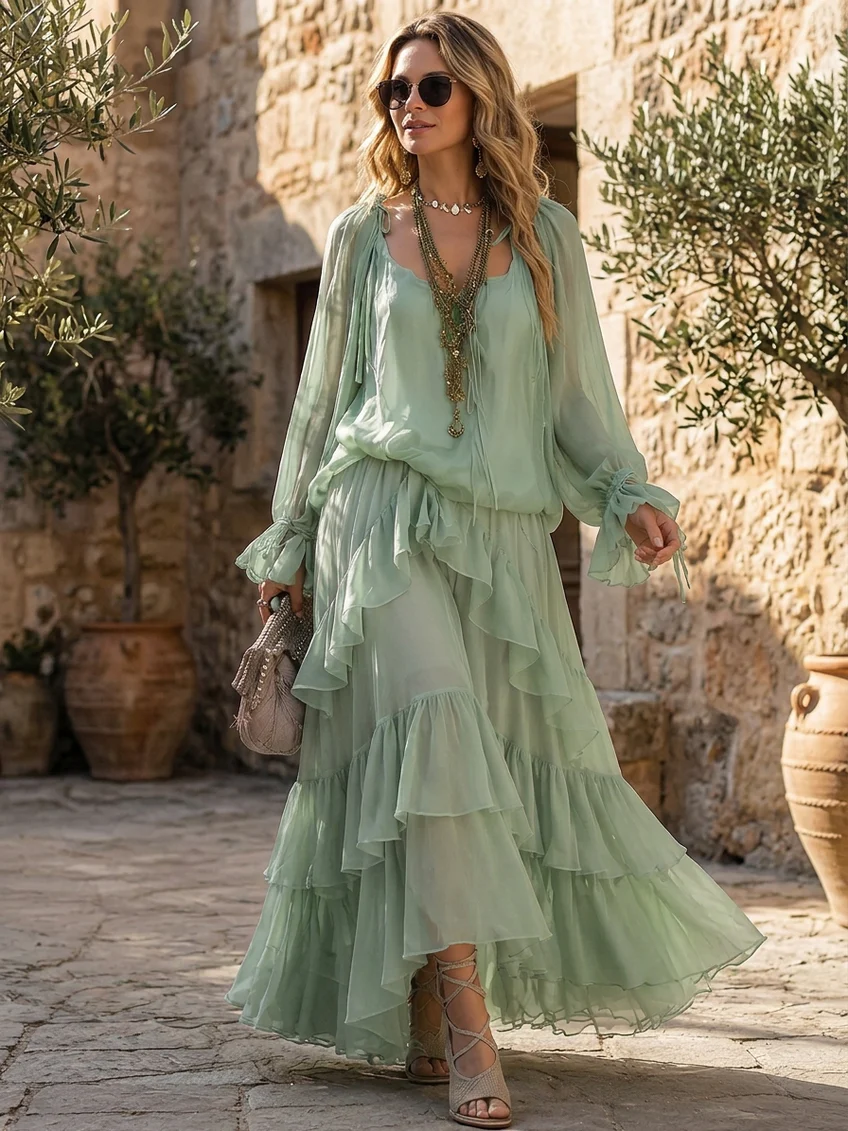 Blusa de gasa verde menta con volantes, acompañada de un conjunto de faldas en capas