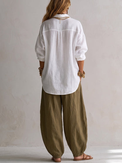 Camisa blanca holgada y pantalón verde de pierna ancha estilo lantern